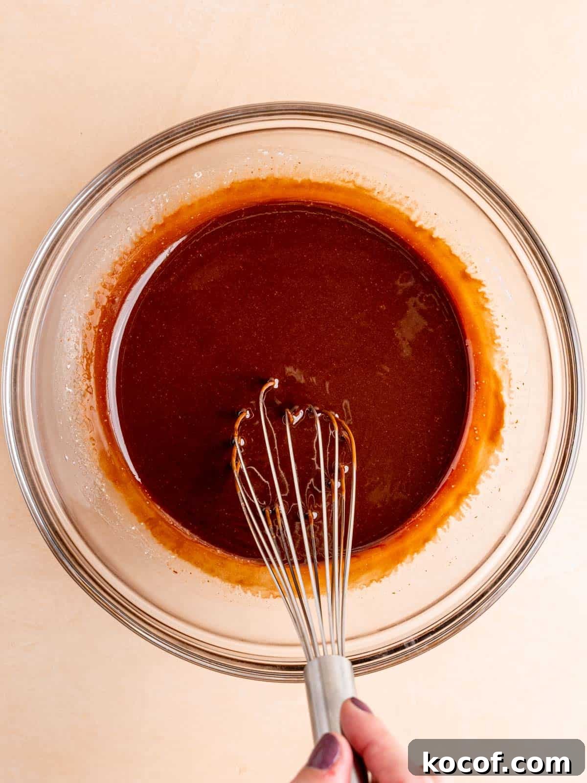 Homemade Chocolate Peanut Butter Brownies Recipe 4 Whisking melted butter and chocolate chips in a bowl.