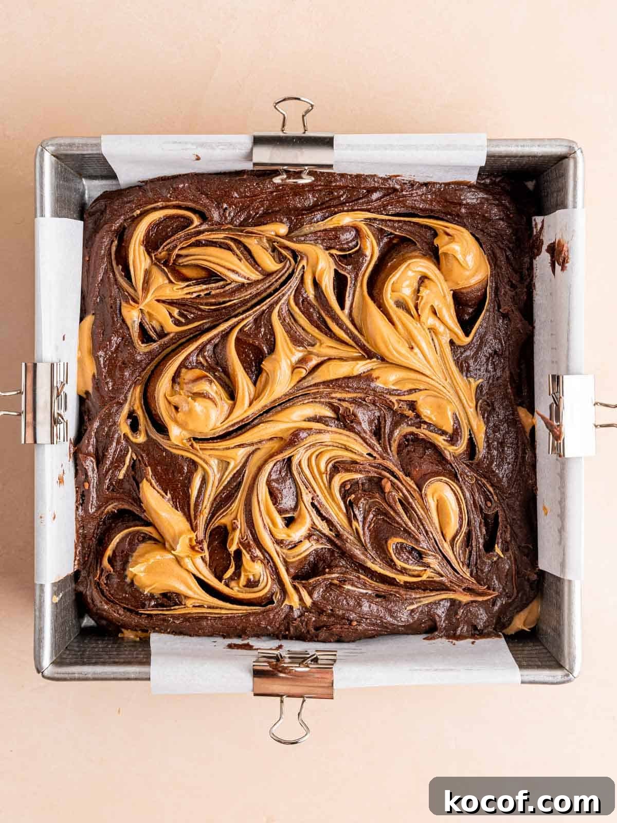 Homemade Chocolate Peanut Butter Brownies Recipe 8 Peanut butter swirled on top of brownie batter in a square pan.