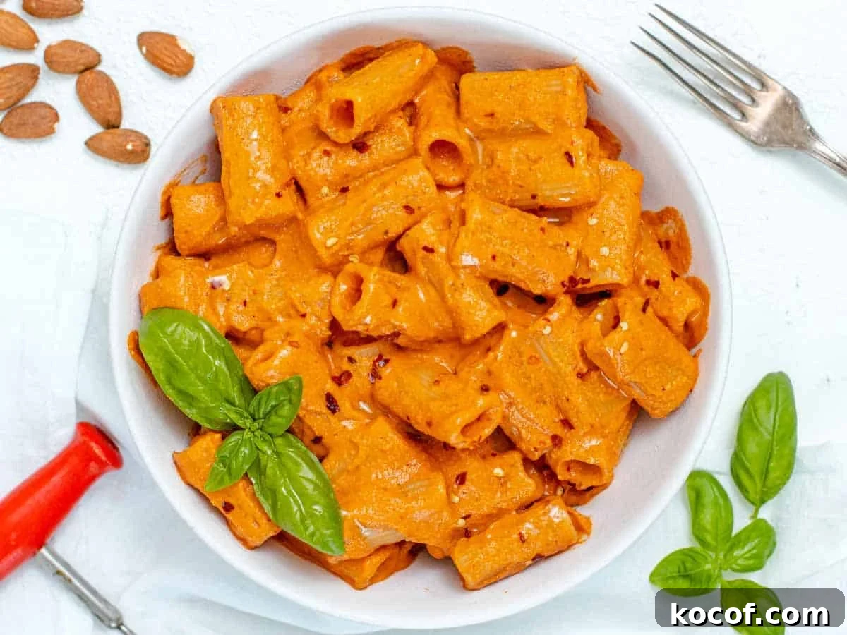 Delicious Vegan Pasta Recipes for Quick Weeknight Dinners 12 Red Pepper Pasta with fresh basil leaves