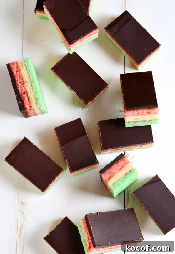 Gluten-Free Rainbow Cookie Recipe for Vibrant Layered Cookies 4 Overhead view of rainbow cookies on white surface.