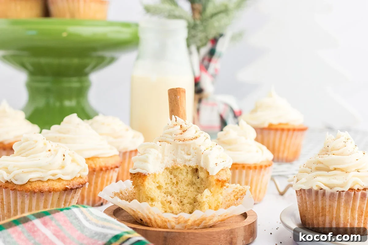 Eggnog cupcake with a bite taken out of it.