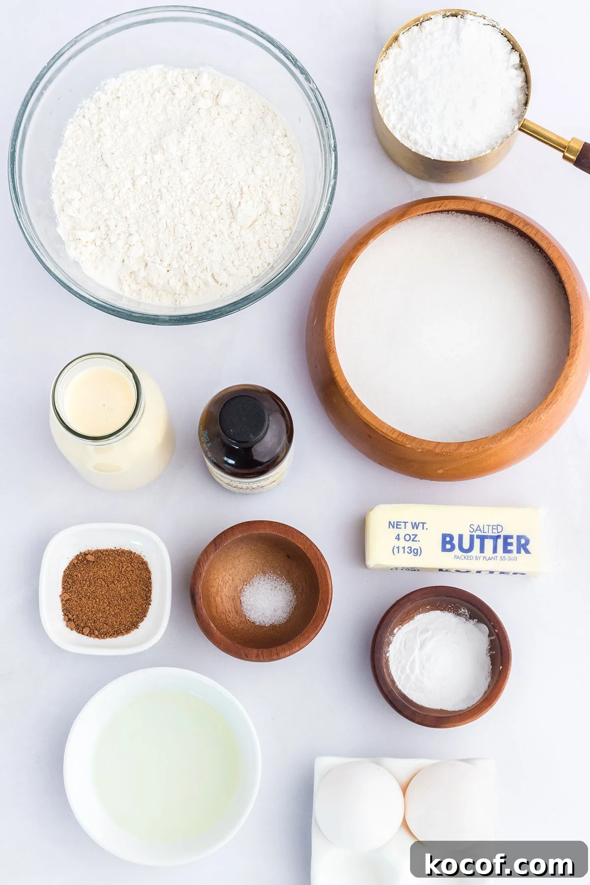 Ingredients to make Eggnog cupcakes set out on the counter.