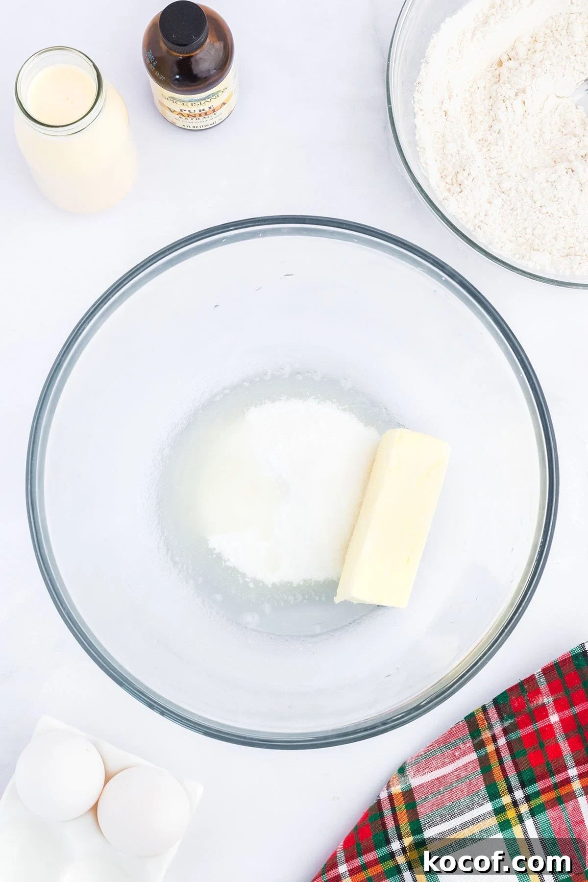 Butter, sugar, and oil in a glass mixing bowl.
