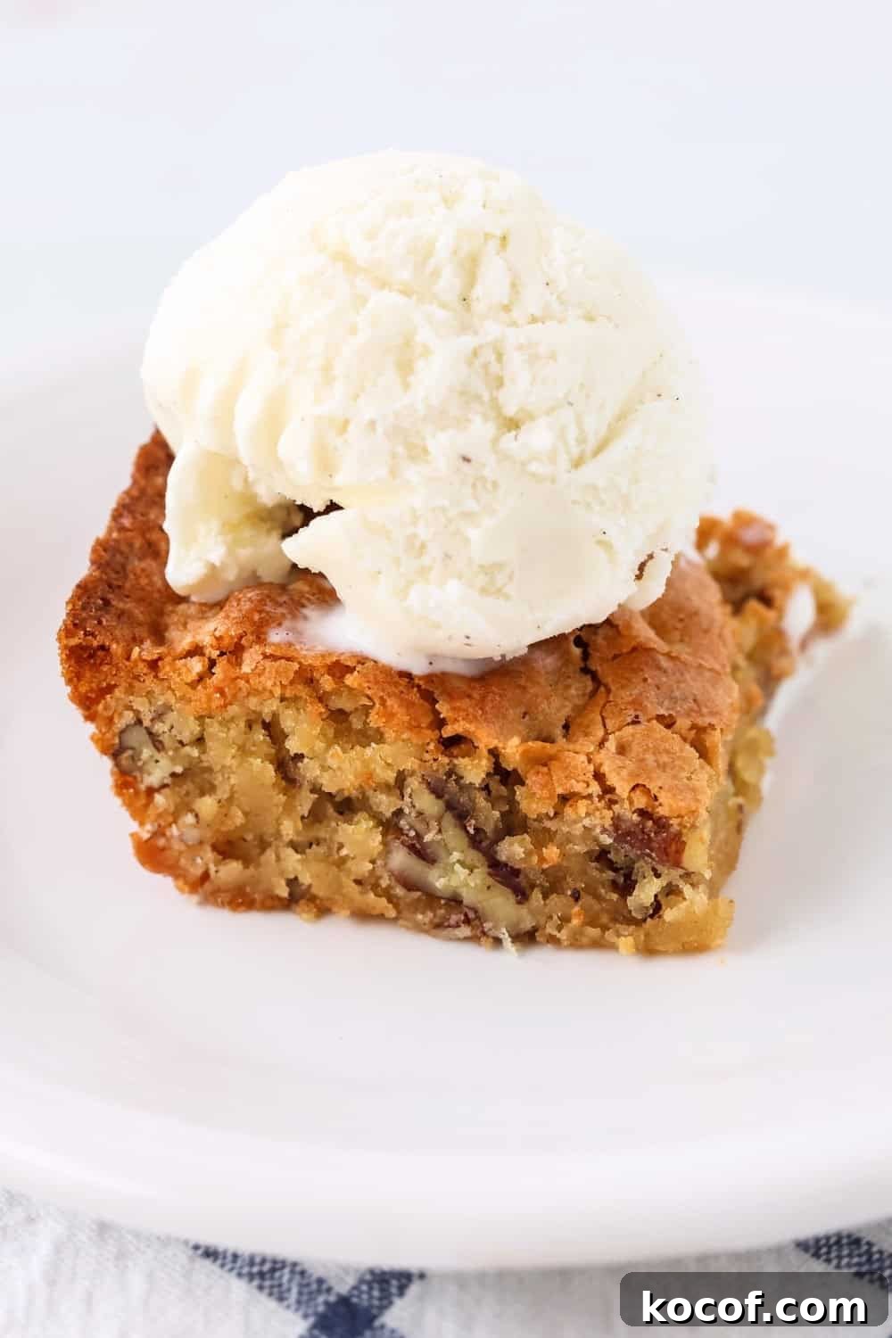 Southern Pecan Quick-Bread Recipe with Brown Sugar Glaze 4 a square of Alabama pecan bread topped with a scoop of vanilla ice cream