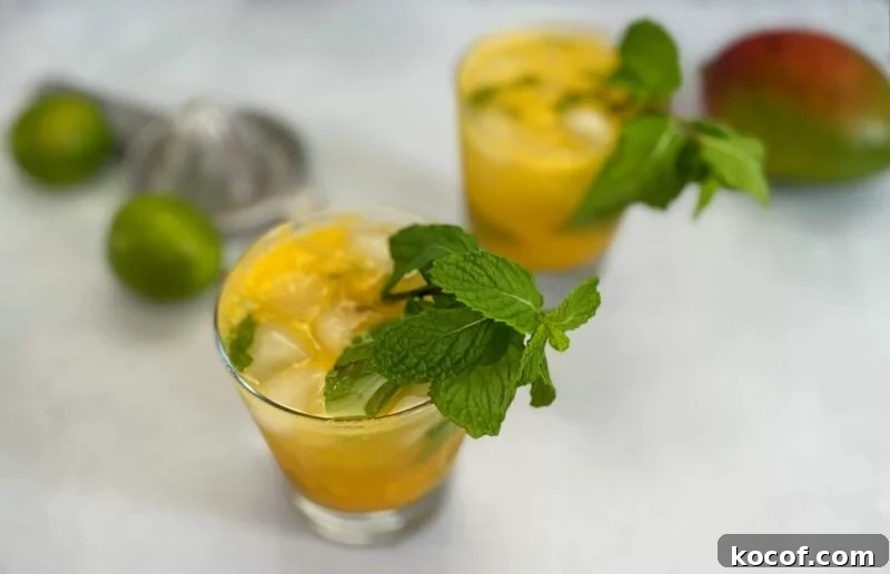 Refreshing Mango Mojito Recipe: Tropical Cocktail Guide 4 mango mojitos in a lowball glass.