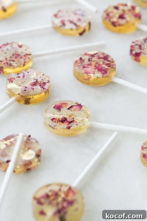 How to Make Homemade Rose Lollipops: Simple Floral Candy Recipe 4 Homemade rose flavored lollipops with edible gold.