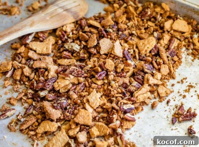 pecans and crushed graham crackers, buttered and toasted on a pan.