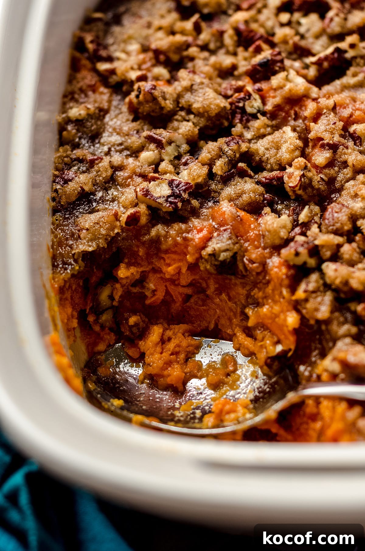 A sweet potato casserole topped with pecans.