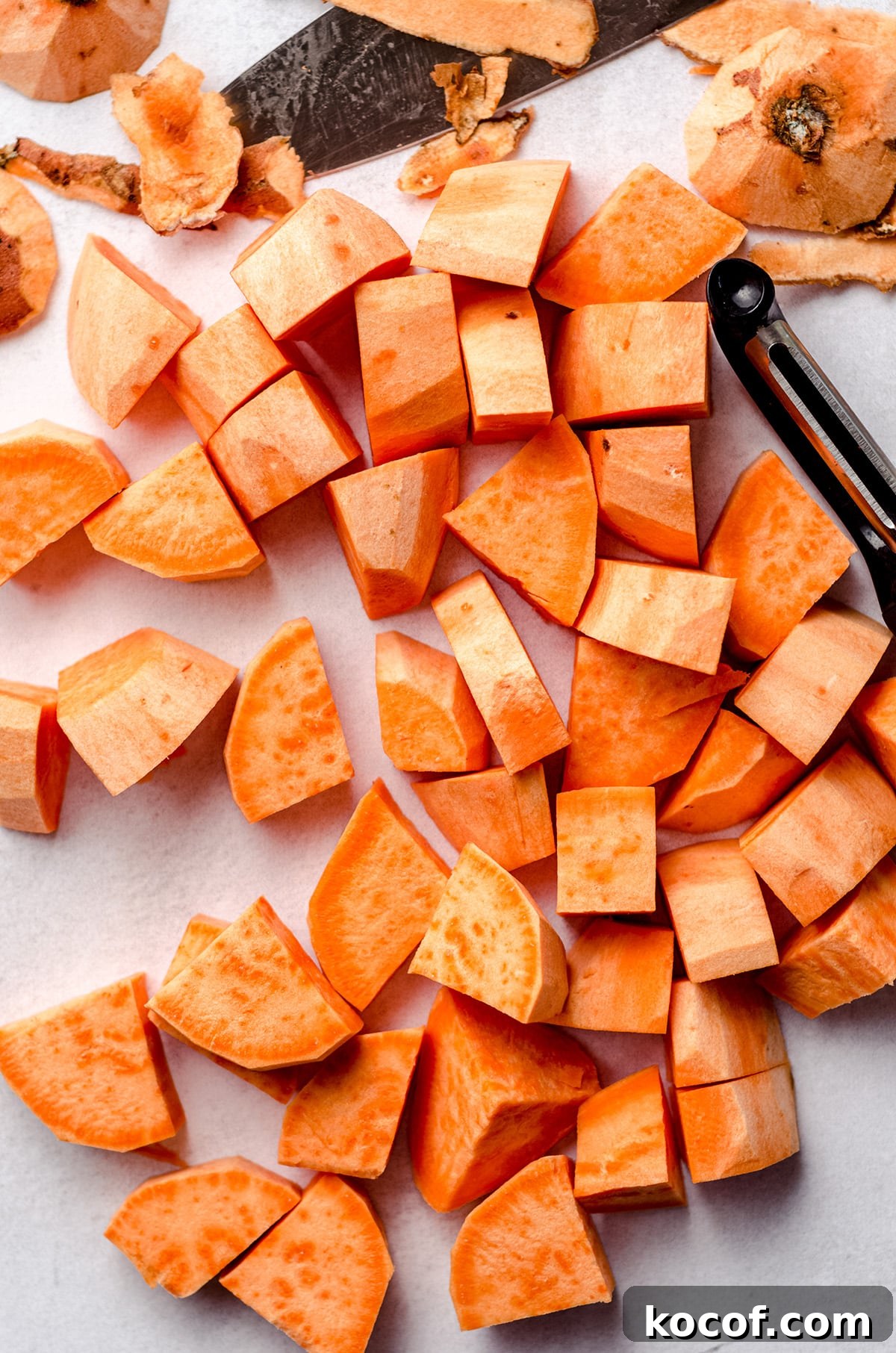 Sweet potato chunks on a white background.