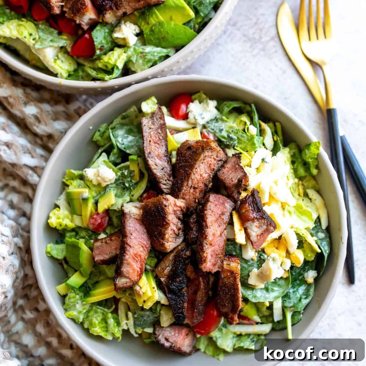 Perfect Blackened Steak Recipe for a Spicy, Crisp Crust 2 Bowl with salad, egg ad blackened steak.