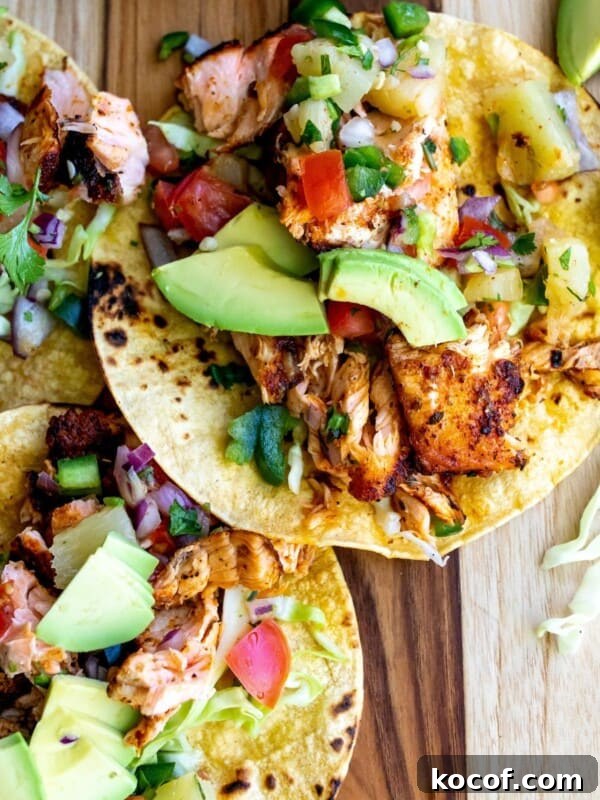 Perfect Blackened Steak Recipe for a Spicy, Crisp Crust 9 Tacos on a cutting board with blackened salmon.