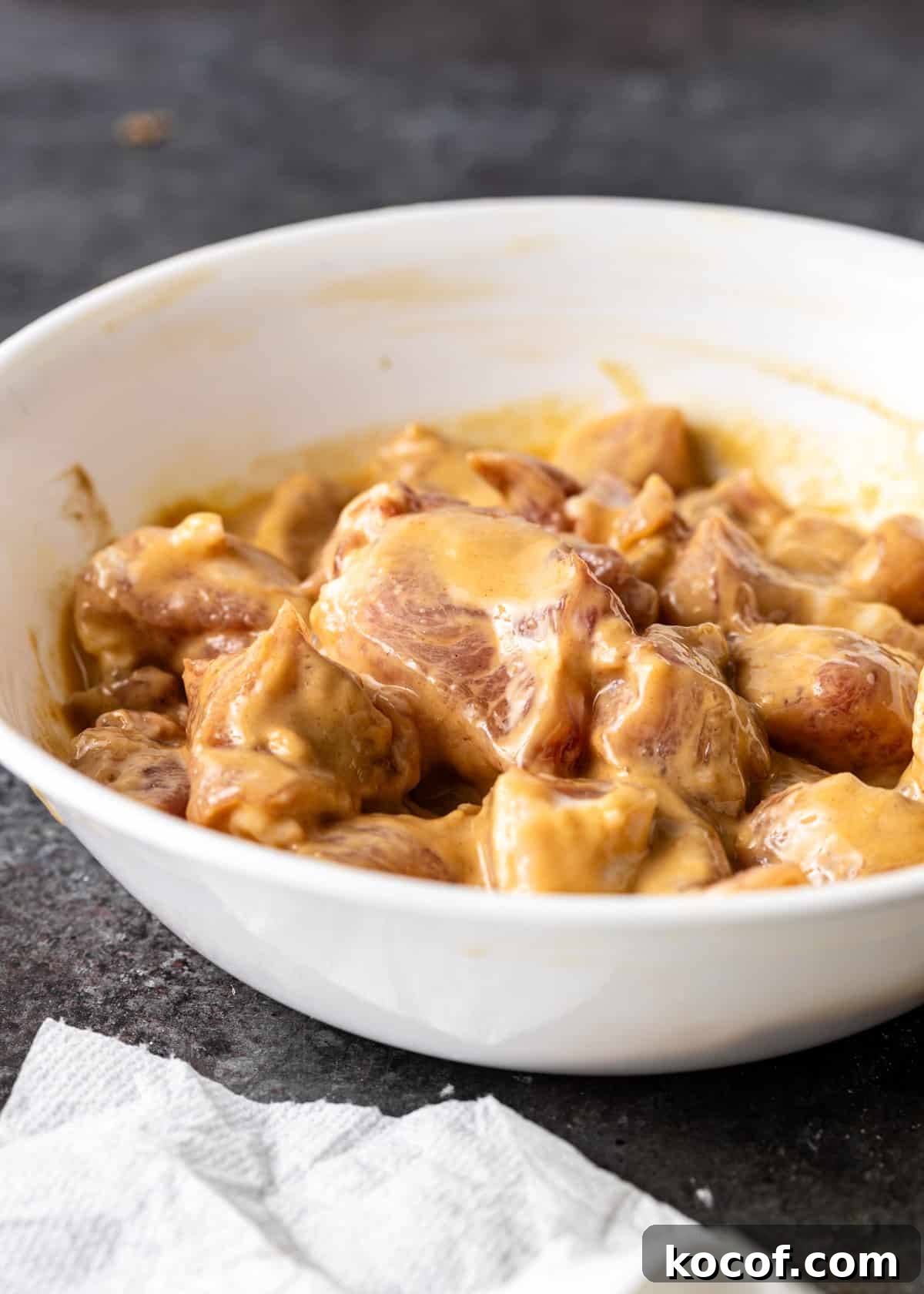 process shot: marinated pork in a bowl for stir fry
