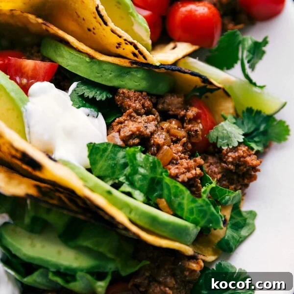 Slow-Cooked Shredded Beef Tacos with Tangy Salsa Verde 5 The ultimate turkey taco recipe, meticulously assembled on a plate with a medley of toppings, eagerly awaiting to be relished.