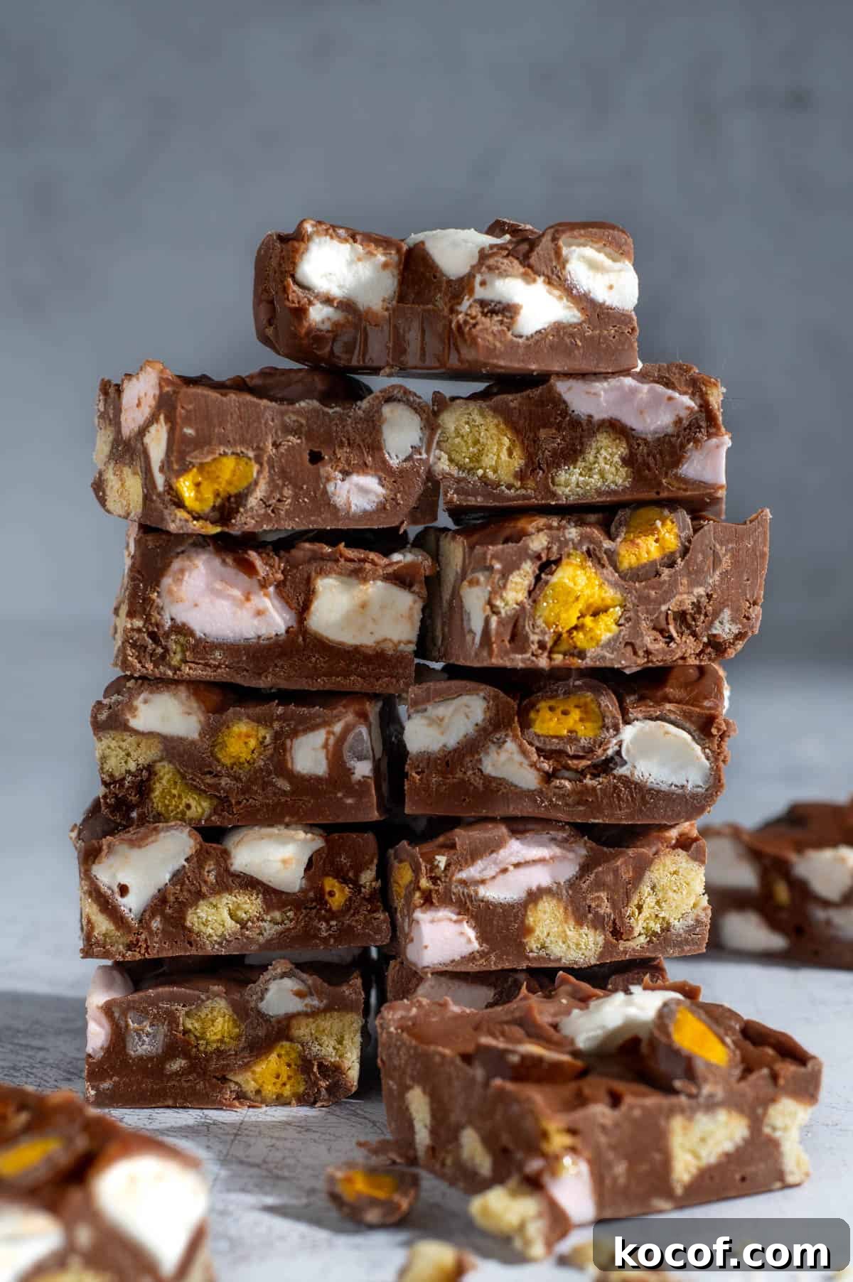 Two stacks of rocky road fudge squares piled up. 