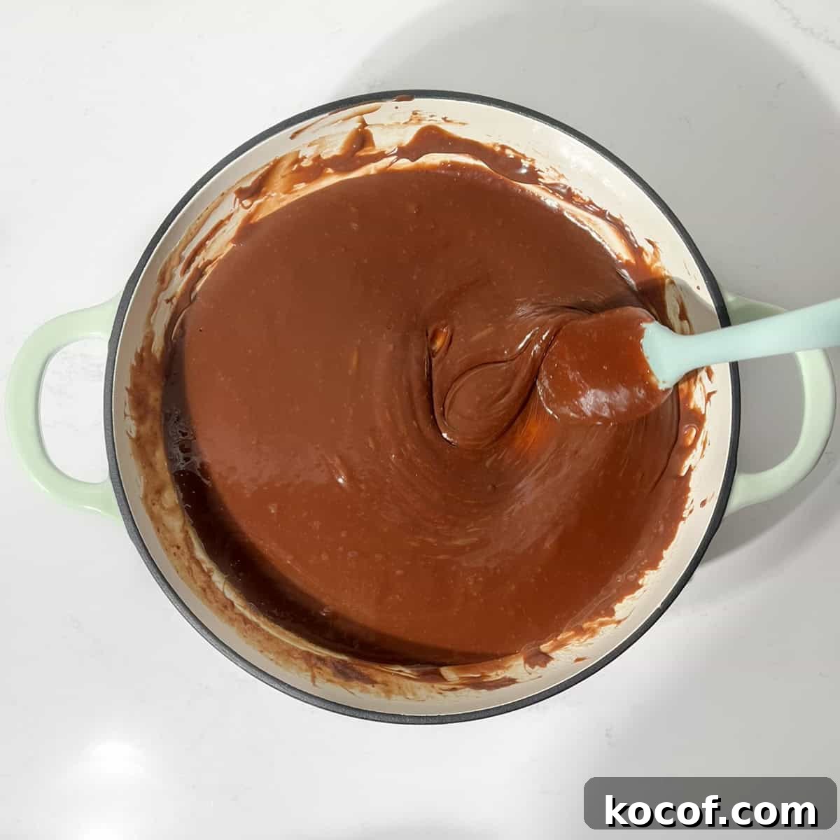 Melted chocolate and condensed milk for the fudge rocky road.