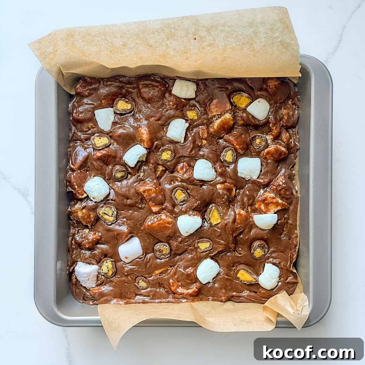 Fudge rocky road mixture in a square baking tin.
