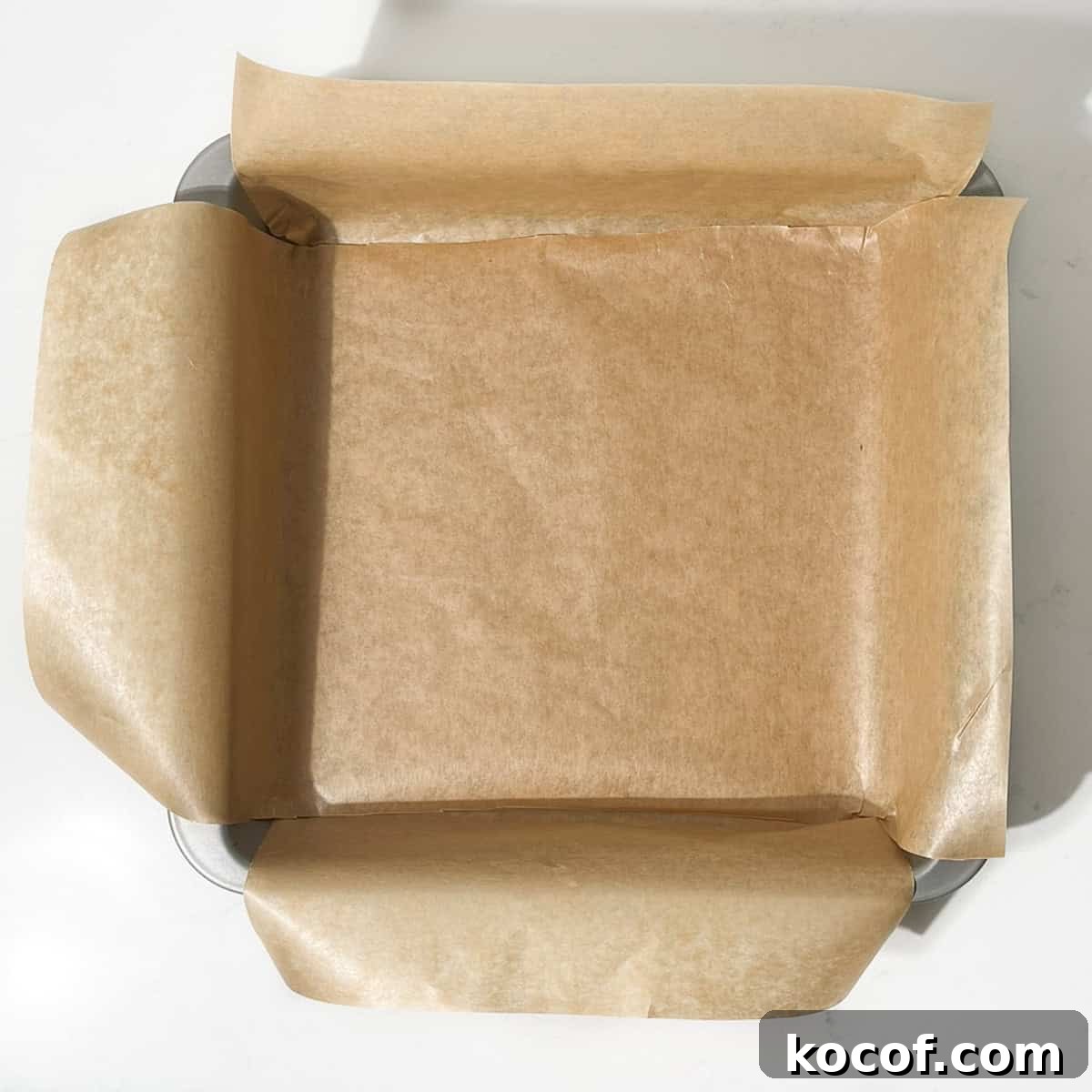 A lined, square baking tin.