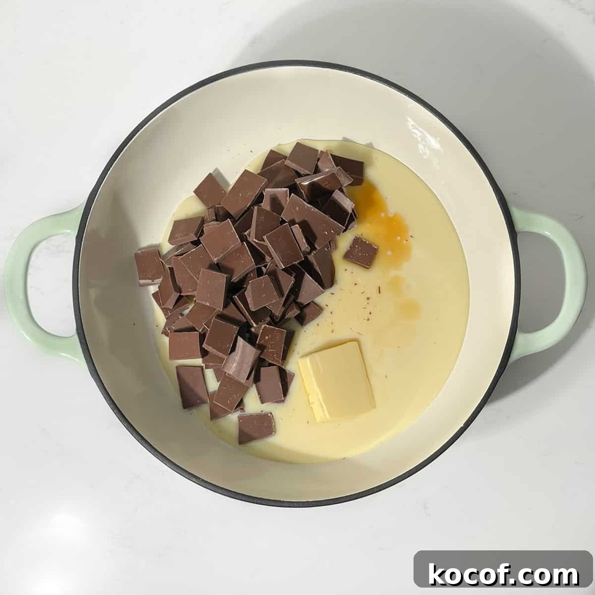 Adding the chocolate, condensed milk and butter to a large saucepan for melting.