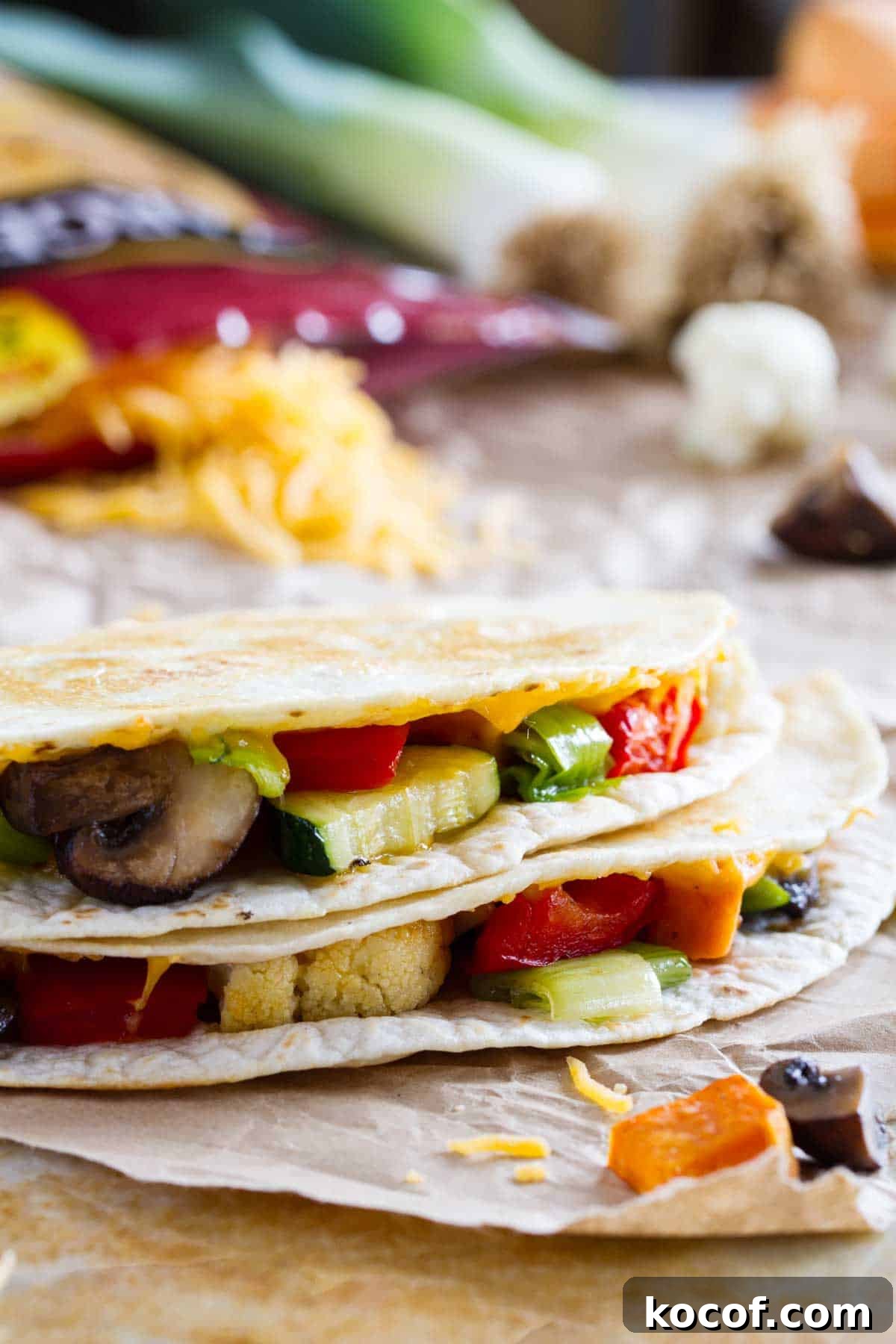 Slices of a veggie quesadilla stacked on top of each other.