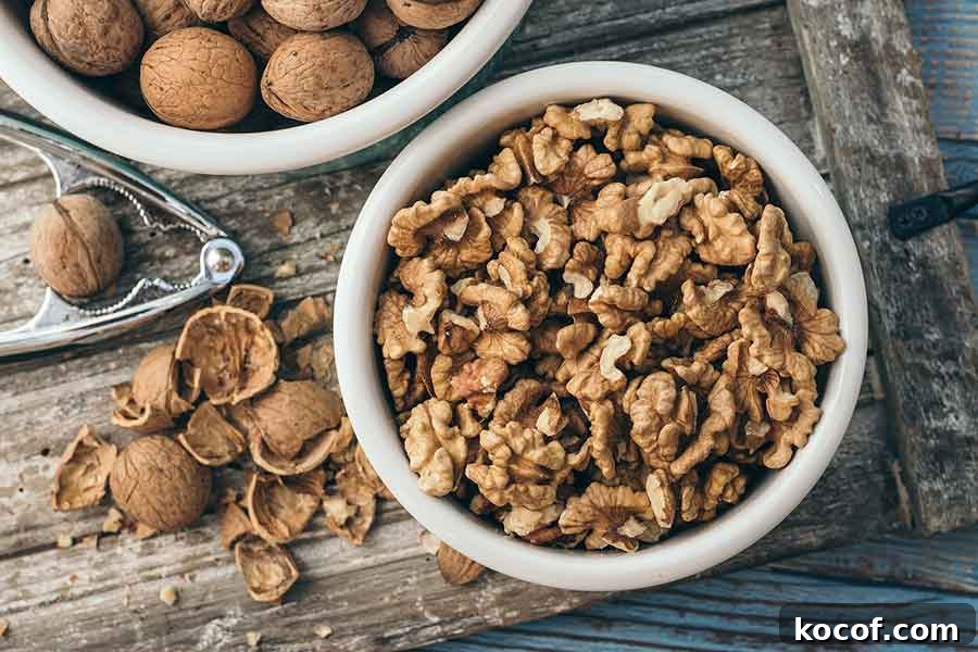 Protein-Packed Ideas for a Gluten-Free Plant-Based Diet 4 cracked walnuts in a bowl with shells on the table