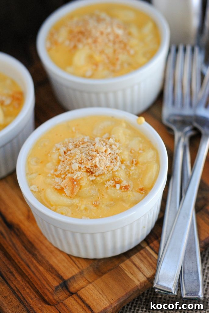 Creamy Homemade Macaroni and Cheese Recipe for Comforting Dinners 3 Cheesy macaroni being stirred