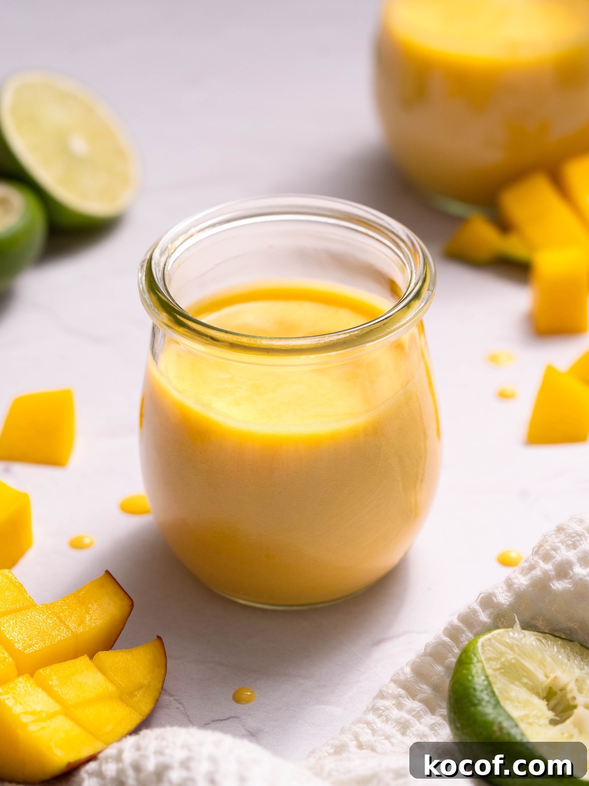 Homemade mango curd in a glass jar