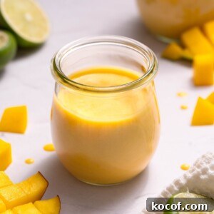 Homemade mango curd in a glass jar