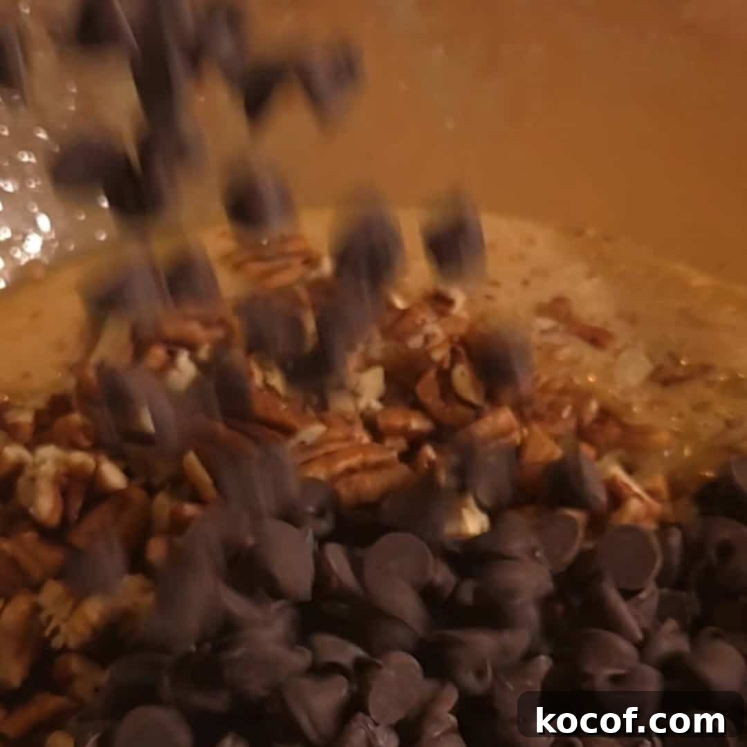 Chocolate Chip Pecan Pie Recipe with Gooey Chocolate Filling 8 Adding chocolate chips and chopped pecans into the pecan pie filling for chocolate chip pecan pie.