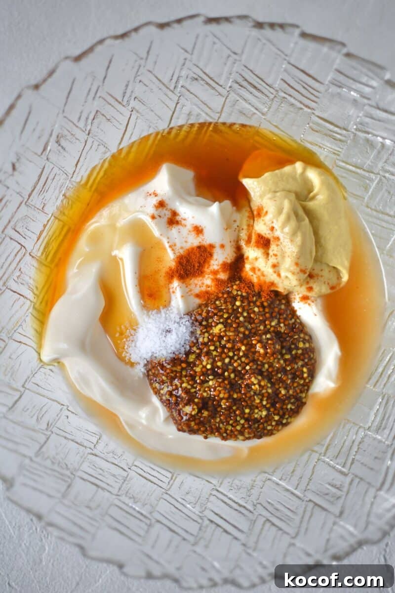Creamy Honey Mustard Dressing Recipe for Salads & Dipping 4 All ingredients for the honey mustard dressing added to a bowl, before mixing.