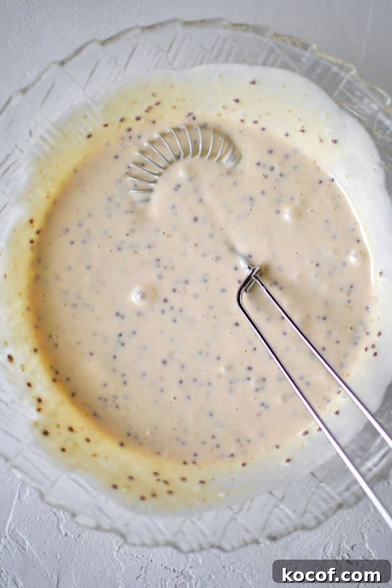 Creamy Honey Mustard Dressing Recipe for Salads & Dipping 5 All ingredients for the honey mustard dressing added to a bowl, after whisking together.