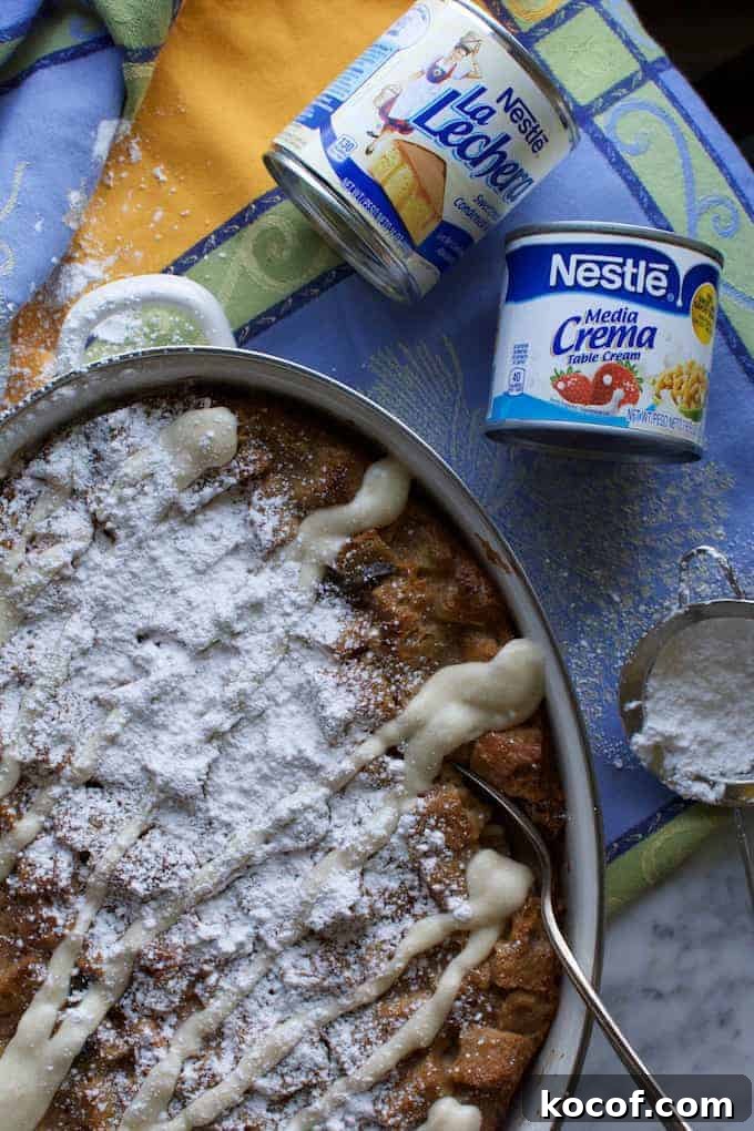 22 Delicious Easter Dinner Ideas That Aren’t Ham 20 A dish of capirotada on a blue and yellow tablecloth with cans of sweetened condensed milk and media cream near by.