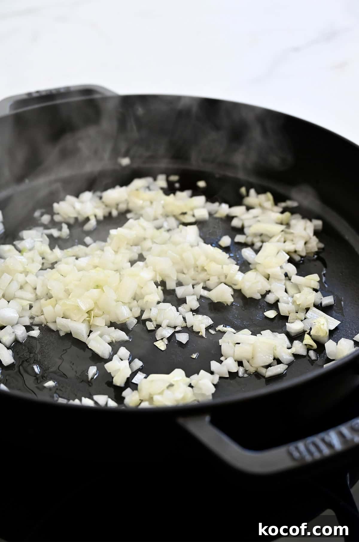 One-Pan Skillet Lasagna Recipe for Quick Weeknight Dinners 5 Sautéed onions in a cast iron skillet.