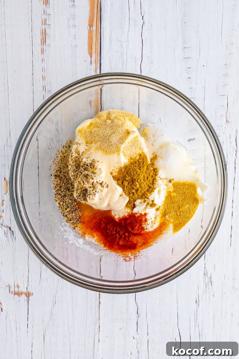 mayo, sour cream, salt, pepper, garlic powder, onion powder, cumin, paprika, sugar, and lime juice in a medium bowl
