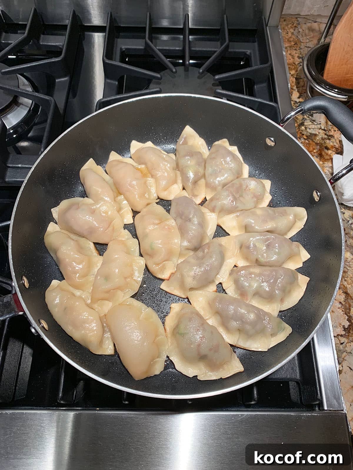 Korean Beef Mandu Dumplings Recipe: Authentic Jew Mandu Guide 12 Pan-frying mandu in a skillet.