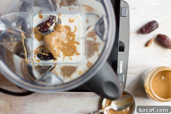 Creamy Almond Butter Date Shake poured into a jar. | @KristinaLaRueRD