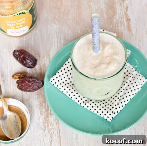 A close-up of Almond Butter Date Shake with visible almond butter swirl. | @KristinaLaRueRD