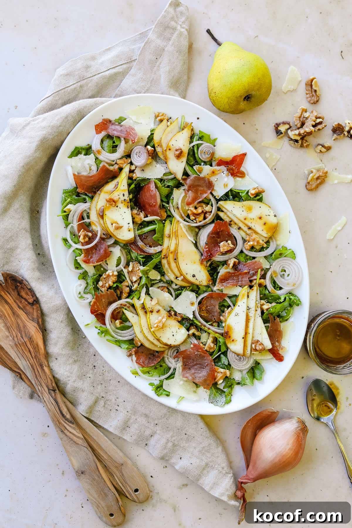 20 Delicious Side Dishes to Serve with Sliders 15 Pear and prosciutto rocket salad on a serving platter with sliced pears, crispy prosciutto, shallots, walnuts, arugula, and a maple balsamic vinaigrette vinaigrette.