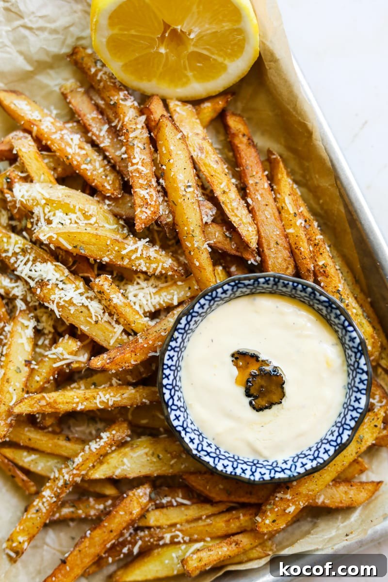 20 Delicious Side Dishes to Serve with Sliders 3 Parmesan truffle friends on a tray with truffle lemon aioli.