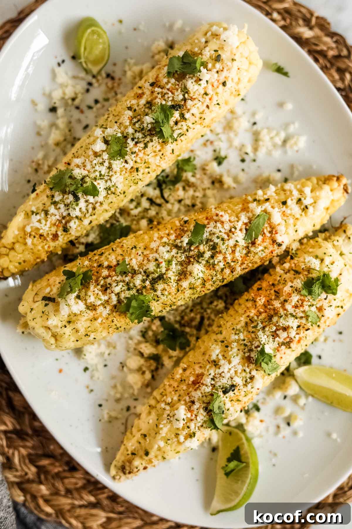 20 Delicious Side Dishes to Serve with Sliders 4 Elote-style corn with furikake and kewpie mayo on a plate flatlay.