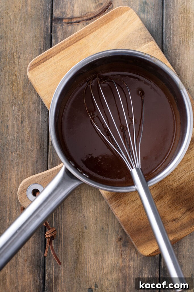 melted butter, Guinness beer and cocoa in a saucepan with a whisk