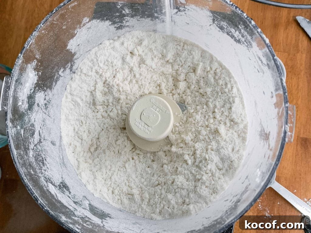 Flaky All-Butter Pie Crust Recipe for Perfect Pastry 3 Pie Crust-Process the butter and flour until it looks like course sand