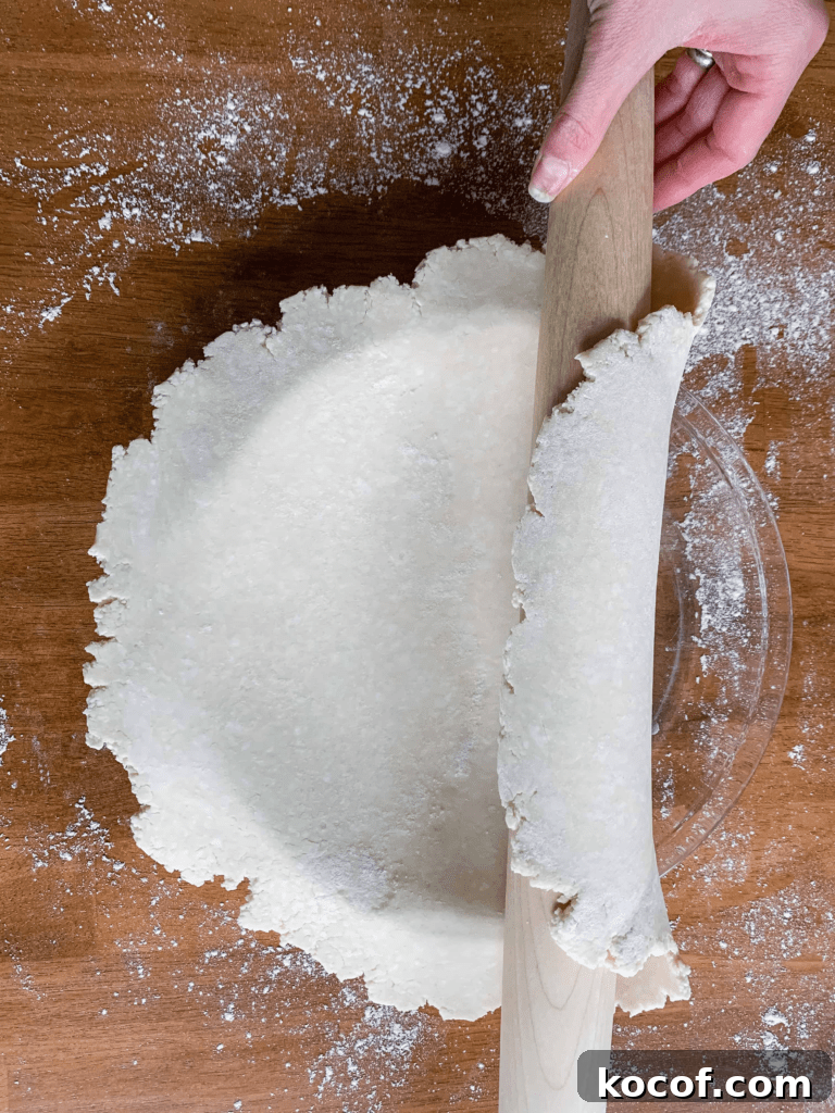 Flaky All-Butter Pie Crust Recipe for Perfect Pastry 5 An easy way to roll pie dough onto your pie plate