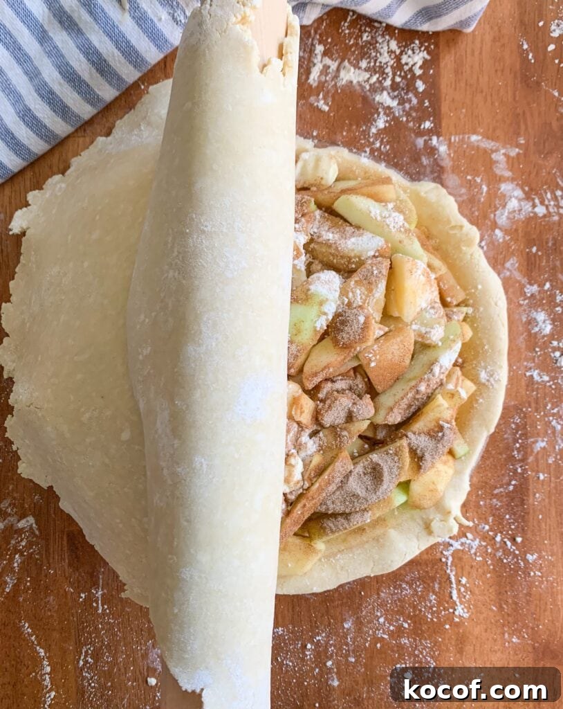 Flaky All-Butter Pie Crust Recipe for Perfect Pastry 8 Use your rolling pin to transfer your top crust to the pie