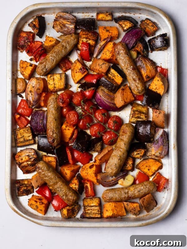 Crispy Herb-Roasted Chicken Thigh Tray Bake with Vegetables 10 Sausages baked on the tray with colourful vegetables.