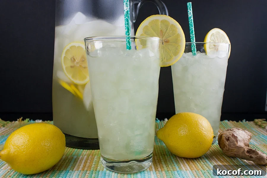 Honey Ginger Lemonade in tall glasses with lemon garnishes.