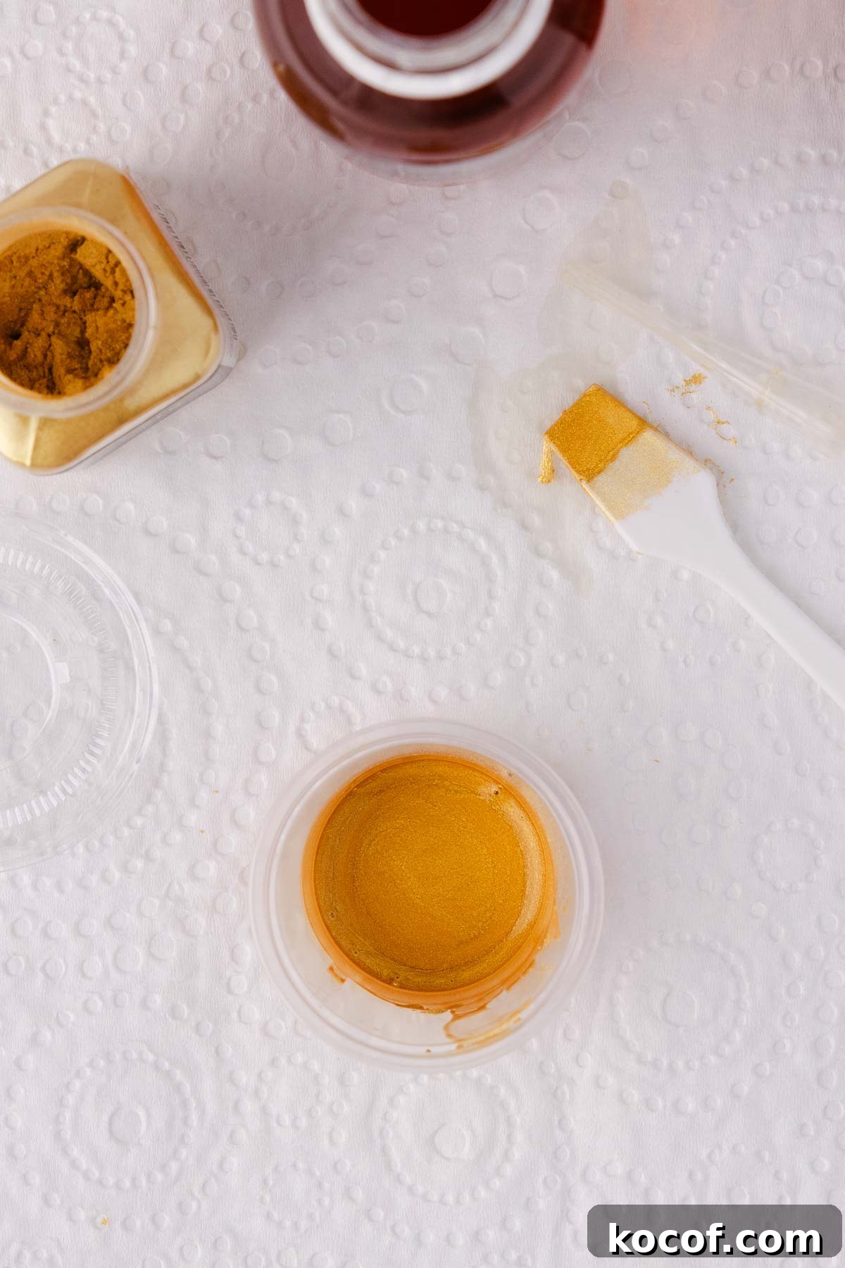 Close up of the container of finished gold paint.
