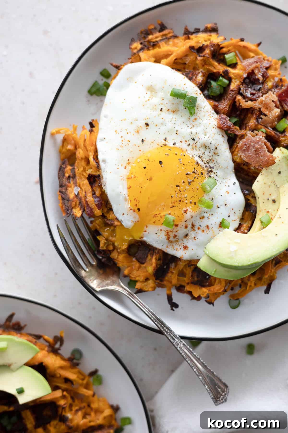 Savory Sweet Potato Waffles with Herbed Yogurt Topping 7 Savory Sweet Potato Waffles topped with egg and avocado.