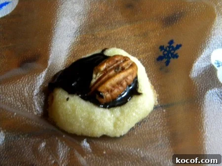 A cookie on a piece of plastic wrap.
