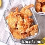 Top down view of a basket of coconut shrimp