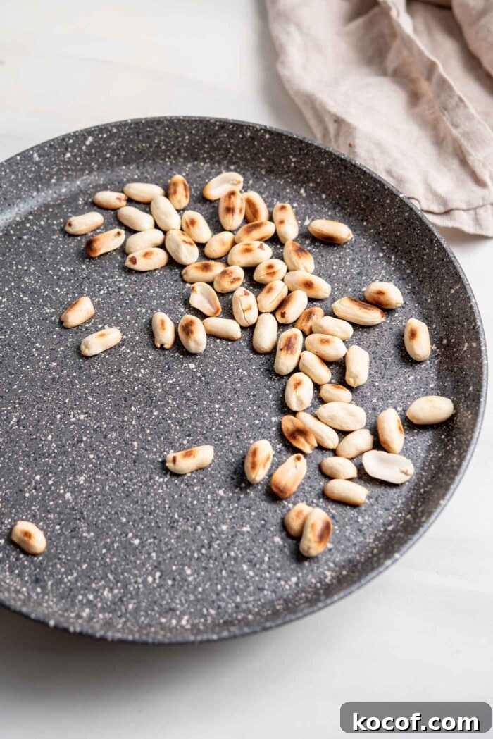 Toasting peanuts in a dry skillet.